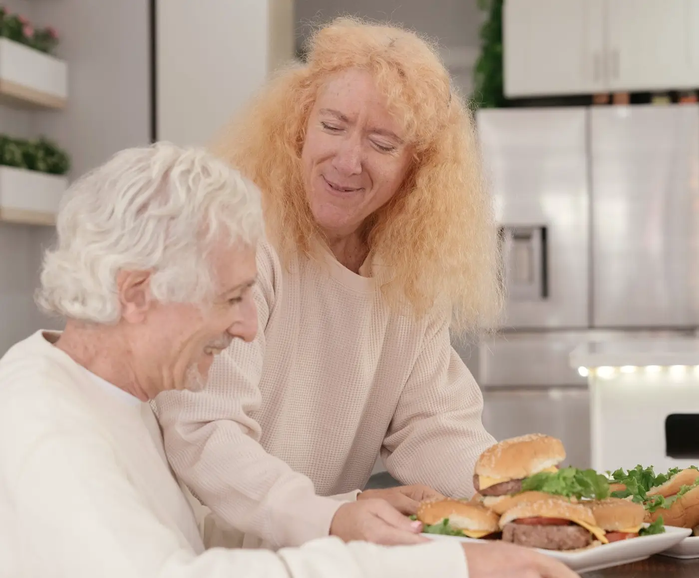 Smiling older couple sharing a meal at home