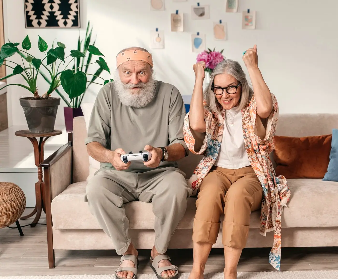 Smiling older couple having fun together in their living room